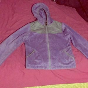 Purple fluffy furry north face jacket.